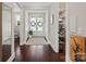 Elegant foyer with dark wood floors, double doors, and a view of the walk-in pantry at 136 Preston Rd, Mooresville, NC 28117