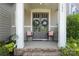 Inviting front porch featuring double doors, stylish seating, and a charming neighborhood vibe at 136 Preston Rd, Mooresville, NC 28117