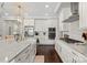 Well-lit kitchen with stainless steel appliances, white cabinets, and a stylish island at 136 Preston Rd, Mooresville, NC 28117