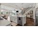 Stylish kitchen island with white countertops, a farmhouse sink, and modern appliances at 136 Preston Rd, Mooresville, NC 28117