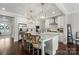 Bright kitchen with an island, stainless appliances, a range hood, and pendant lighting at 136 Preston Rd, Mooresville, NC 28117