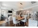 Open-concept living space with a dining area, fireplace, and modern furnishings at 136 Preston Rd, Mooresville, NC 28117