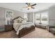 Serene main bedroom with large windows offering natural light and a cozy seating area at 136 Preston Rd, Mooresville, NC 28117