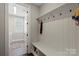Well-organized mudroom featuring a bench with storage and coat hooks, providing a convenient space at 136 Preston Rd, Mooresville, NC 28117