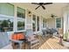 Relaxing back patio with a view of the water, plenty of comfortable seating, and room for outdoor gatherings at 136 Preston Rd, Mooresville, NC 28117