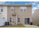 Back exterior with vinyl siding, patio area, lawn, privacy fence, and satellite dish at 13612 Singleleaf Ln, Charlotte, NC 28278