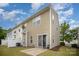 Back exterior of a home with sliding door, patio, lawn and vinyl siding at 13612 Singleleaf Ln, Charlotte, NC 28278