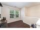 Bright bonus room features neutral paint, a window and sleek wood flooring at 13612 Singleleaf Ln, Charlotte, NC 28278