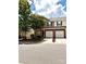 Charming townhome features an attached one-car garage and classic brick accents at 13612 Singleleaf Ln, Charlotte, NC 28278