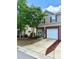 Inviting townhome with a well-manicured lawn and attached one-car garage at 13612 Singleleaf Ln, Charlotte, NC 28278