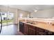 Open kitchen with sleek appliances, leading to an outdoor patio at 13612 Singleleaf Ln, Charlotte, NC 28278