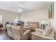 Comfortable living room featuring new floors and a ceiling fan for added comfort at 13612 Singleleaf Ln, Charlotte, NC 28278