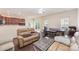 Open concept living area with modern flooring and sliding glass doors to the outside at 13612 Singleleaf Ln, Charlotte, NC 28278