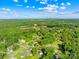 Aerial view of a neighborhood with tree-lined streets, well-maintained lawns and multiple homes at 1408 Delview Rd, Cherryville, NC 28021