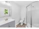 Bathroom featuring a modern vanity, a new toilet, and a frameless glass walk-in shower at 1408 Delview Rd, Cherryville, NC 28021