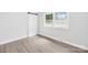 A light filled bedroom with gray wood-look floors, a large closet, and neutral walls at 1408 Delview Rd, Cherryville, NC 28021