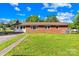 The house has a well-manicured lawn with a sidewalk leading up to the front door at 1408 Delview Rd, Cherryville, NC 28021