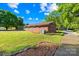 Lovely brick ranch-style home with mature trees and lush lawn at 1408 Delview Rd, Cherryville, NC 28021