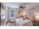 Charming bedroom featuring a cozy bed, window with blinds, and decorative wall hangings at 14512 Brotherly Ln, Charlotte, NC 28278