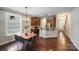 Open dining area and kitchen features granite counters, stainless appliances, and ample cabinet space at 14512 Brotherly Ln, Charlotte, NC 28278