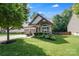 Charming home with lush lawn, tasteful landscaping, and welcoming covered porch, perfect for relaxing at 14512 Brotherly Ln, Charlotte, NC 28278