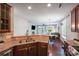 Open kitchen overlooking the dining and living areas with sleek countertops and stainless steel appliances at 14512 Brotherly Ln, Charlotte, NC 28278