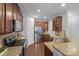 Well-lit kitchen featuring granite countertops, stainless steel appliances, and wood cabinets at 14512 Brotherly Ln, Charlotte, NC 28278
