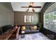 Inviting living room with a modern desk, beautiful artwork, and a comfortable gray couch at 14512 Brotherly Ln, Charlotte, NC 28278