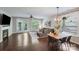 Open-concept living and dining area with lots of natural light and patio access at 14512 Brotherly Ln, Charlotte, NC 28278