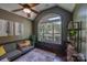 Cozy living room featuring vaulted ceilings, abundant natural light, and stylish decor at 14512 Brotherly Ln, Charlotte, NC 28278
