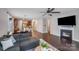 Spacious open floor plan with hardwood floors, fireplace, connecting living room, dining, and kitchen at 14512 Brotherly Ln, Charlotte, NC 28278