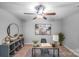 This room provides a quiet, comfortable office space, featuring ceiling fan and stylish decor at 14512 Brotherly Ln, Charlotte, NC 28278