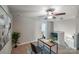Bright office space featuring a modern desk, comfortable chair, and view of the upstairs landing at 14512 Brotherly Ln, Charlotte, NC 28278