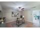Comfortable home office featuring neutral paint, stylish decor, and a ceiling fan at 14512 Brotherly Ln, Charlotte, NC 28278