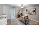 Functional office space featuring a desk, artwork, and view to another room at 14512 Brotherly Ln, Charlotte, NC 28278
