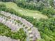 Aerial view of neighborhood featuring mature trees and well-manicured golf course at 14822 Rocky Top Dr, Huntersville, NC 28078
