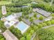 Beautiful aerial view featuring swimming pools, tennis courts and a picturesque pond at 14822 Rocky Top Dr, Huntersville, NC 28078