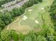 Overhead view of the well-maintained golf course surrounded by beautiful mature trees at 14822 Rocky Top Dr, Huntersville, NC 28078