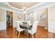 Elegant dining room featuring a decorative chandelier and sophisticated decor at 14822 Rocky Top Dr, Huntersville, NC 28078
