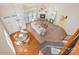 Bright living room with vaulted ceiling, cozy fireplace, and open floor plan with adjacent dining area at 14822 Rocky Top Dr, Huntersville, NC 28078