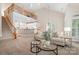 Open-concept living area with soaring ceilings, leading to the adjacent kitchen and dining area at 14822 Rocky Top Dr, Huntersville, NC 28078