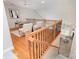 Upstairs loft featuring hardwood floors, open railing, and sitting area, perfect for a home office at 14822 Rocky Top Dr, Huntersville, NC 28078