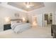 Spacious main bedroom with a tray ceiling and en-suite bathroom access at 14822 Rocky Top Dr, Huntersville, NC 28078
