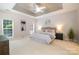 Large main bedroom with a tray ceiling and ample natural light at 14822 Rocky Top Dr, Huntersville, NC 28078
