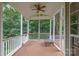 Screened-in porch with fan, wood deck, and railing, offering an outdoor living space at 14822 Rocky Top Dr, Huntersville, NC 28078