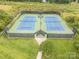 Aerial view of community tennis courts featuring lighting for evening games at 14822 Rocky Top Dr, Huntersville, NC 28078