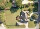 Aerial view of brick home showing large landscaped lot with privacy fence and mature landscaping at 150 Northchase Dr, Concord, NC 28027