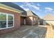 Brick home featuring a wood deck under a partly cloudy sky at 150 Northchase Dr, Concord, NC 28027