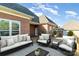 Stylish outdoor seating area on a wooden deck of a brick home at 150 Northchase Dr, Concord, NC 28027