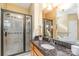 Bright bathroom offers a walk-in shower and a dark granite countertop with sink at 150 Northchase Dr, Concord, NC 28027